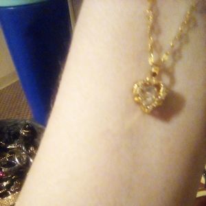 Shimmering heart pendent 18 in.chain worn a hand full of times.